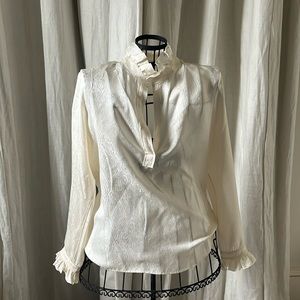 Nili Lotan cream silk ruffled blouse.